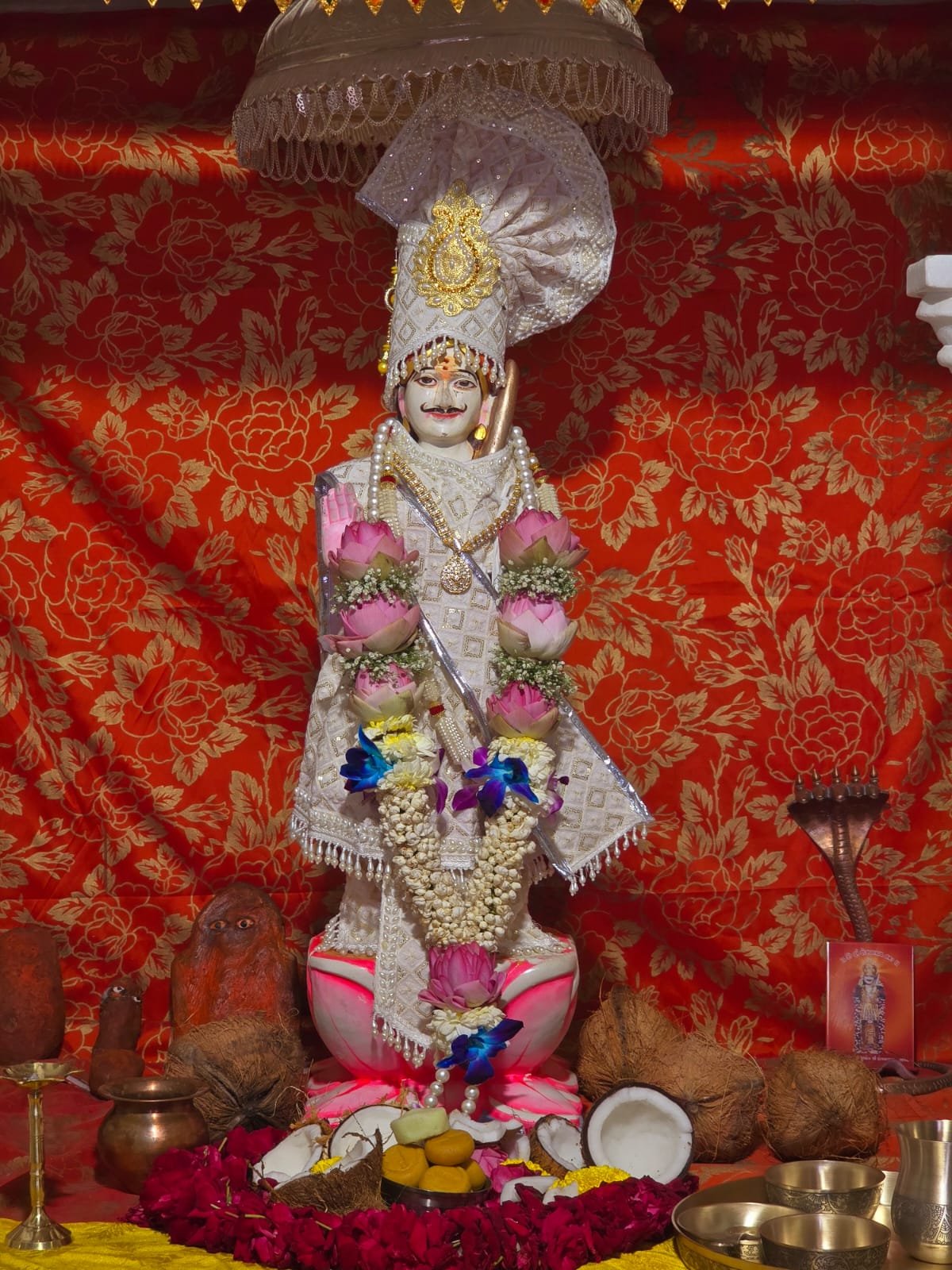 Decorated deity in shrine